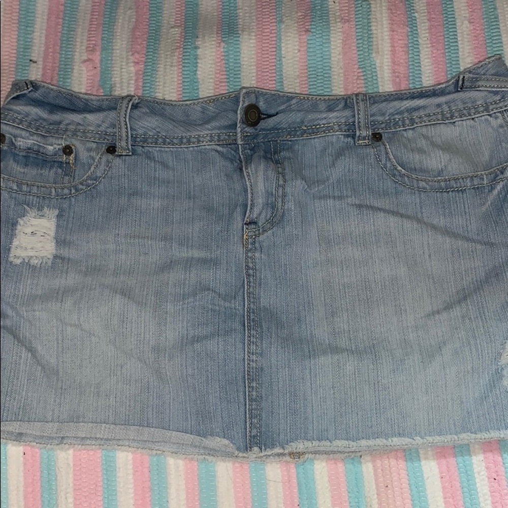 Distressed denim mini skirt